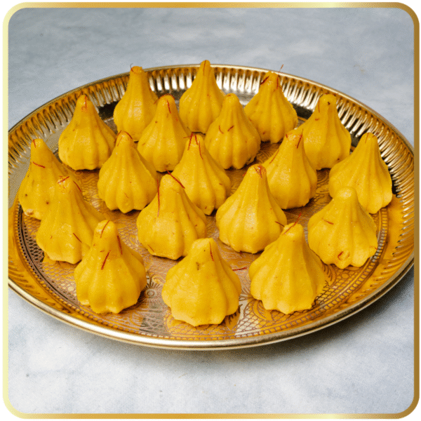 Kesar Modak – saffron-flavored modak with rich aroma by Gangdhar Mithaiwale – Ganesh Chaturthi special sweet