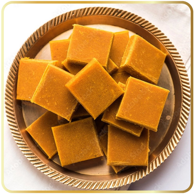 Amba Barfi – soft mango barfi in yellow-orange color by Gangdhar Mithaiwale