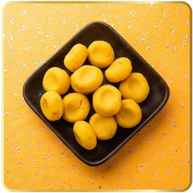 Golden yellow Kesar Pedha topped with saffron strands – Gangdhar Mithaiwale